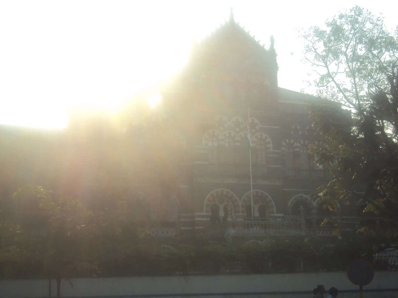 The Bombay Riots take place in the city now known as Mumbai: 2012 photograph of Mumbai police headquarters, institutional context for the 1992–1993 Bombay communal riots; not an image of those riots.