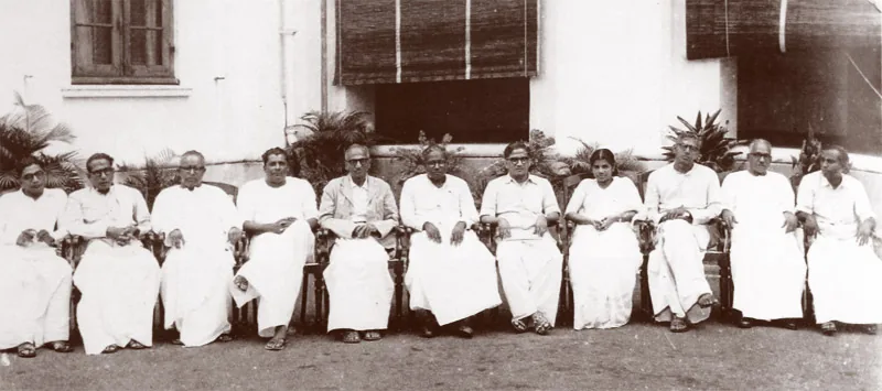 The Communist Party of India wins the elections in Kerala, making E: Group photograph of E. M. S. Namboodiripad and his first Kerala ministry dated 5 April 1957, after the Communist Party of India's election victory.
