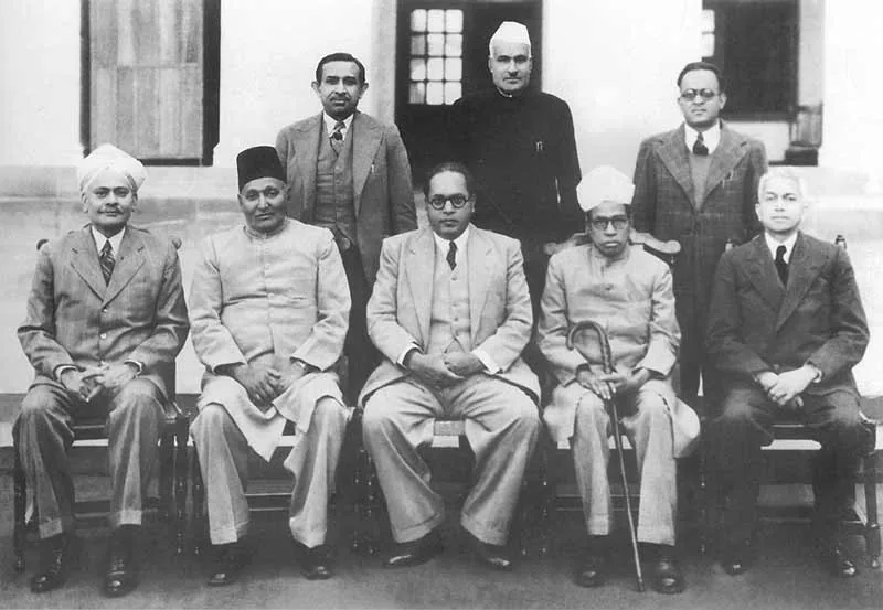 Drafting Committee appointed: Archival group photograph of B. R. Ambedkar and the other Constitution Drafting Committee members on 29 August 1947, the date the committee was appointed. Commons lists both the historical PD-India basis and CC0, but API reports Public domain; verify rights tags at local QA.