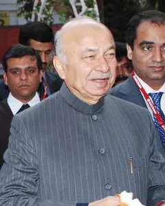 Birth of Sushilkumar Shinde: Shinde at the Elecrama 2010 inauguration, decades after his birth in 1941. It is a later photograph of the same individual, not a 1941 birth photograph.