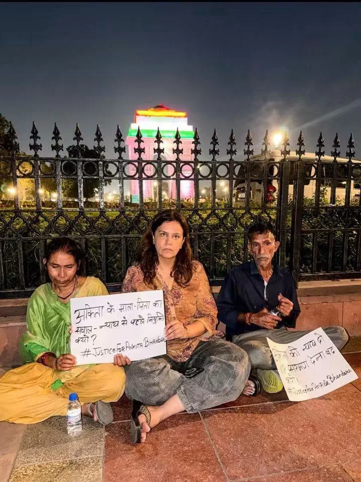 Justice for Ankita Bhandari sit-in near India Gate: user-authorized photograph of demonstrators holding protest signs; exact capture date requires verification